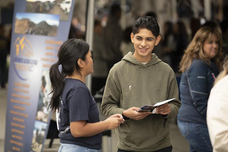 Students mid-conversation on campus